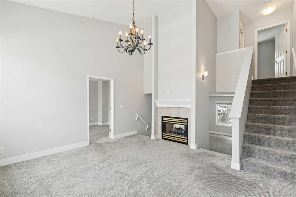 328 Prominence Heights Sw, Calgary, AB - Indoor Photo Showing Other Room With Fireplace
