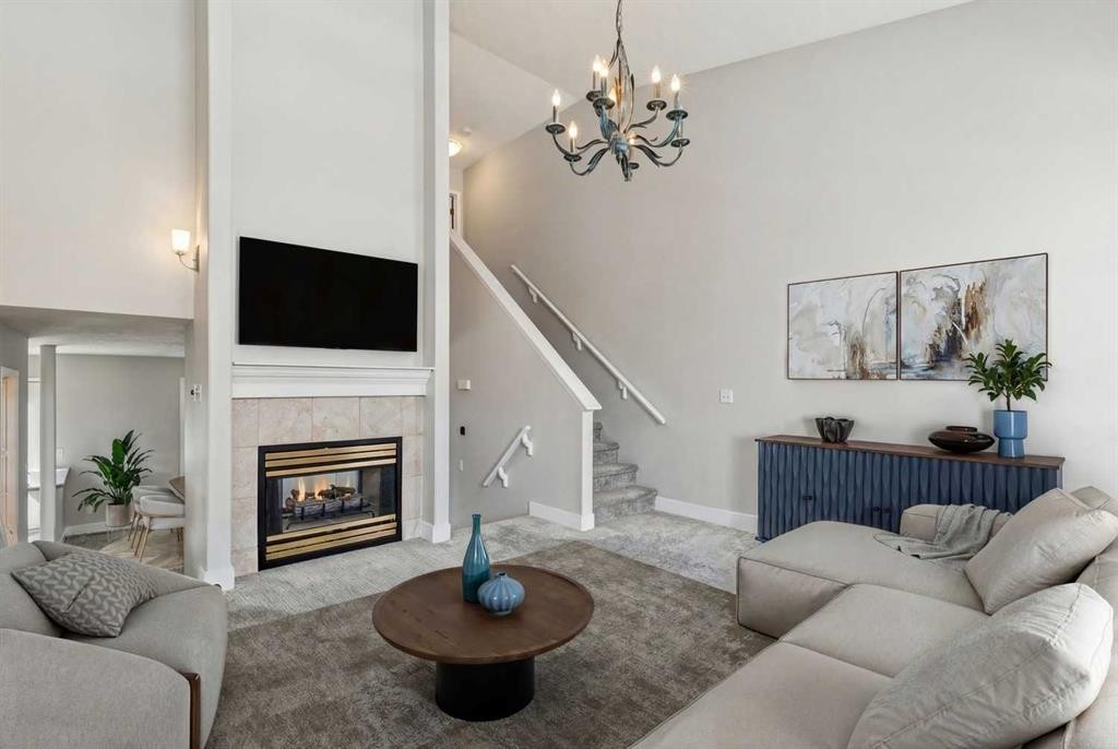 328 Prominence Heights Sw, Calgary, AB - Indoor Photo Showing Living Room With Fireplace