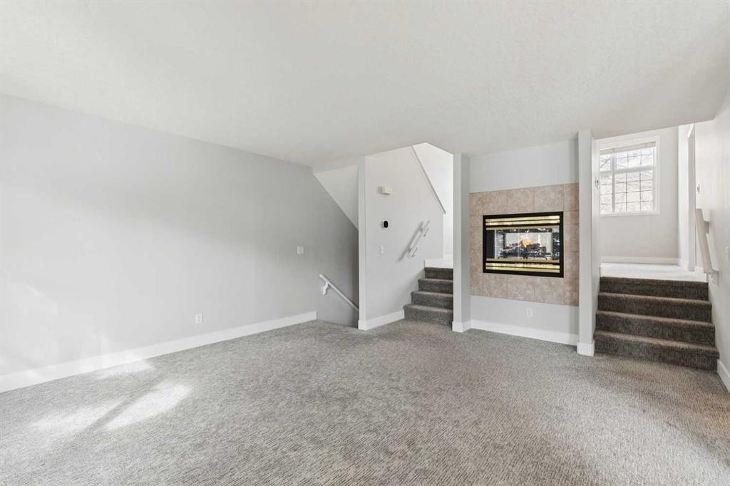 328 Prominence Heights Sw, Calgary, AB - Indoor With Fireplace