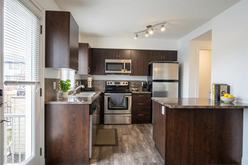 132 Copperpond Boulevard Se, Calgary, AB - Indoor Photo Showing Kitchen With Stainless Steel Kitchen With Double Sink