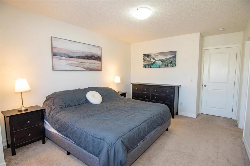 132 Copperpond Boulevard Se, Calgary, AB - Indoor Photo Showing Bedroom
