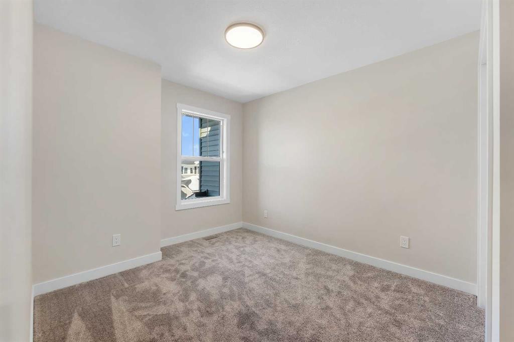 1047 Bayview Crescent, Airdrie, AB - Indoor Photo Showing Other Room