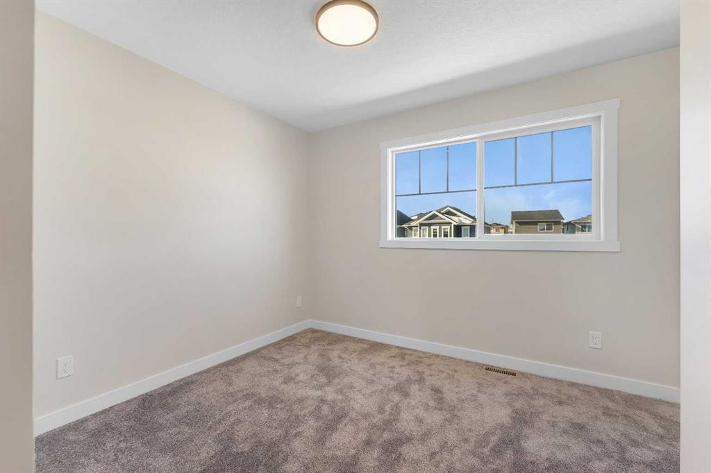 1047 Bayview Crescent, Airdrie, AB - Indoor Photo Showing Other Room