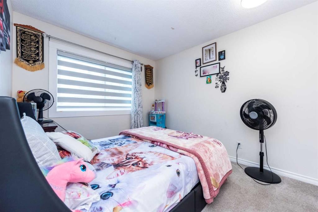 39 Tararidge Drive Ne, Calgary, AB - Indoor Photo Showing Bedroom