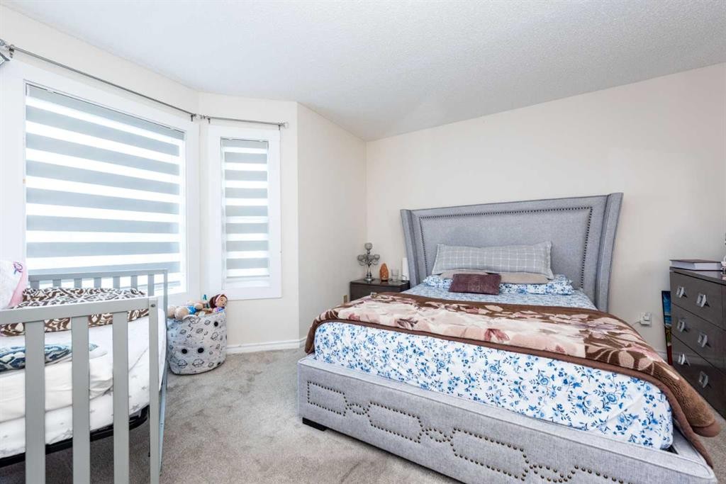 39 Tararidge Drive Ne, Calgary, AB - Indoor Photo Showing Bedroom