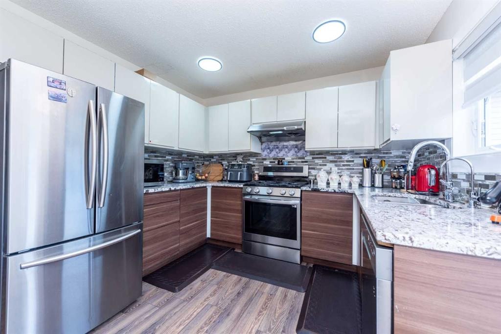 39 Tararidge Drive Ne, Calgary, AB - Indoor Photo Showing Kitchen With Stainless Steel Kitchen With Upgraded Kitchen