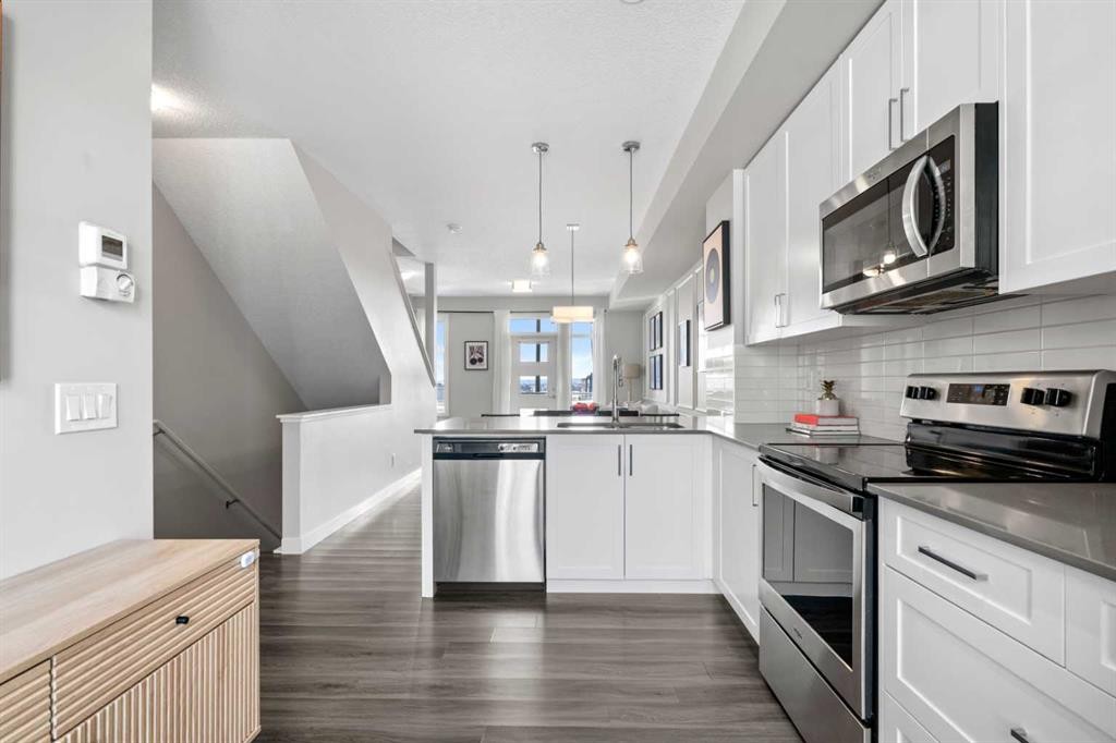 126 Seton Passage Se, Calgary, AB - Indoor Photo Showing Kitchen With Upgraded Kitchen