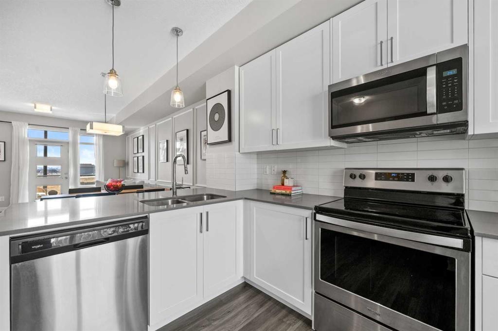 126 Seton Passage Se, Calgary, AB - Indoor Photo Showing Kitchen With Double Sink With Upgraded Kitchen