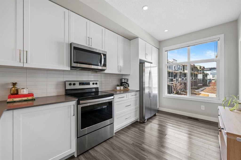 126 Seton Passage Se, Calgary, AB - Indoor Photo Showing Kitchen With Upgraded Kitchen