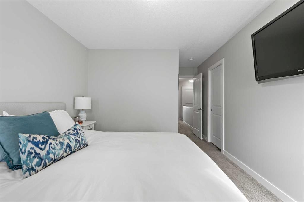 126 Seton Passage Se, Calgary, AB - Indoor Photo Showing Bedroom