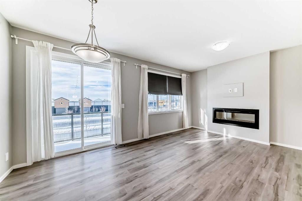 224 Carringham Way Nw, Calgary, AB - Indoor Photo Showing Living Room With Fireplace