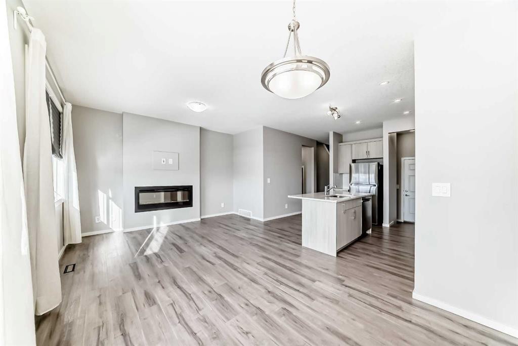 224 Carringham Way Nw, Calgary, AB - Indoor With Fireplace