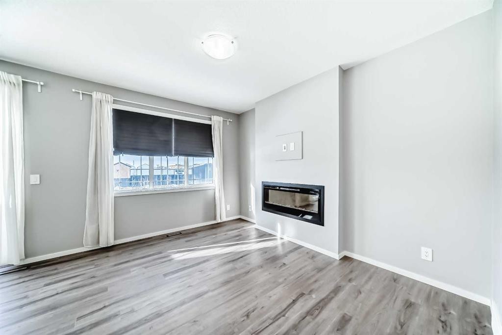 224 Carringham Way Nw, Calgary, AB - Indoor With Fireplace