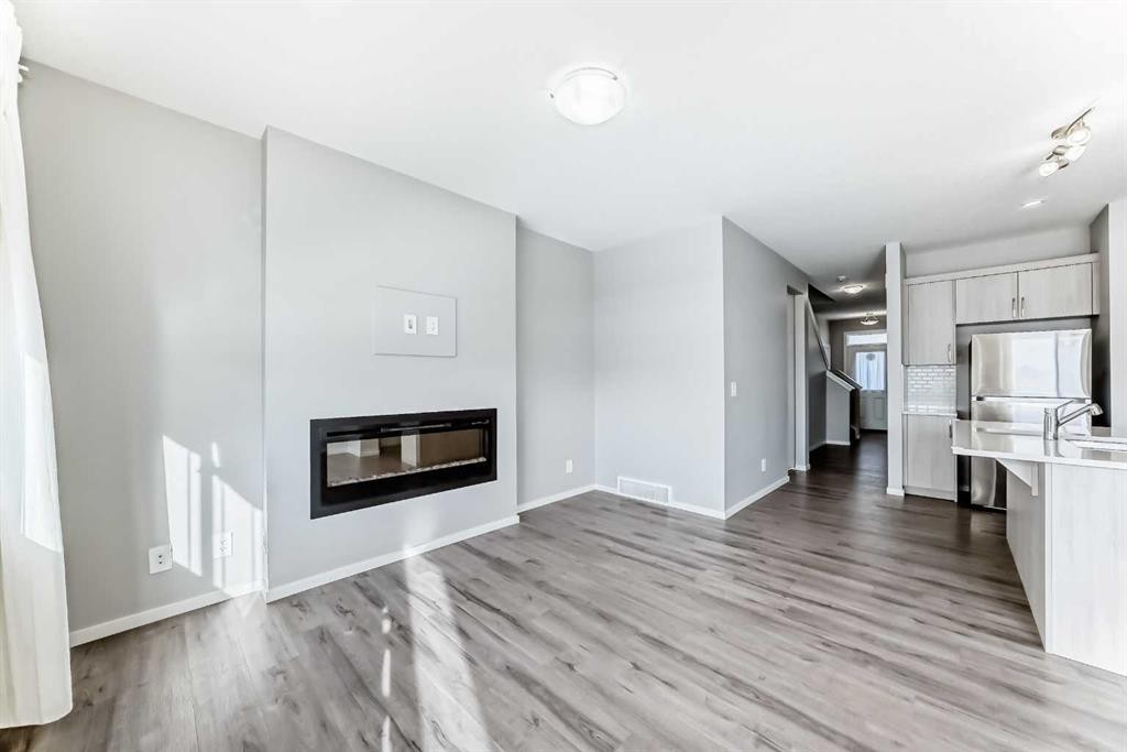 224 Carringham Way Nw, Calgary, AB - Indoor Photo Showing Other Room With Fireplace