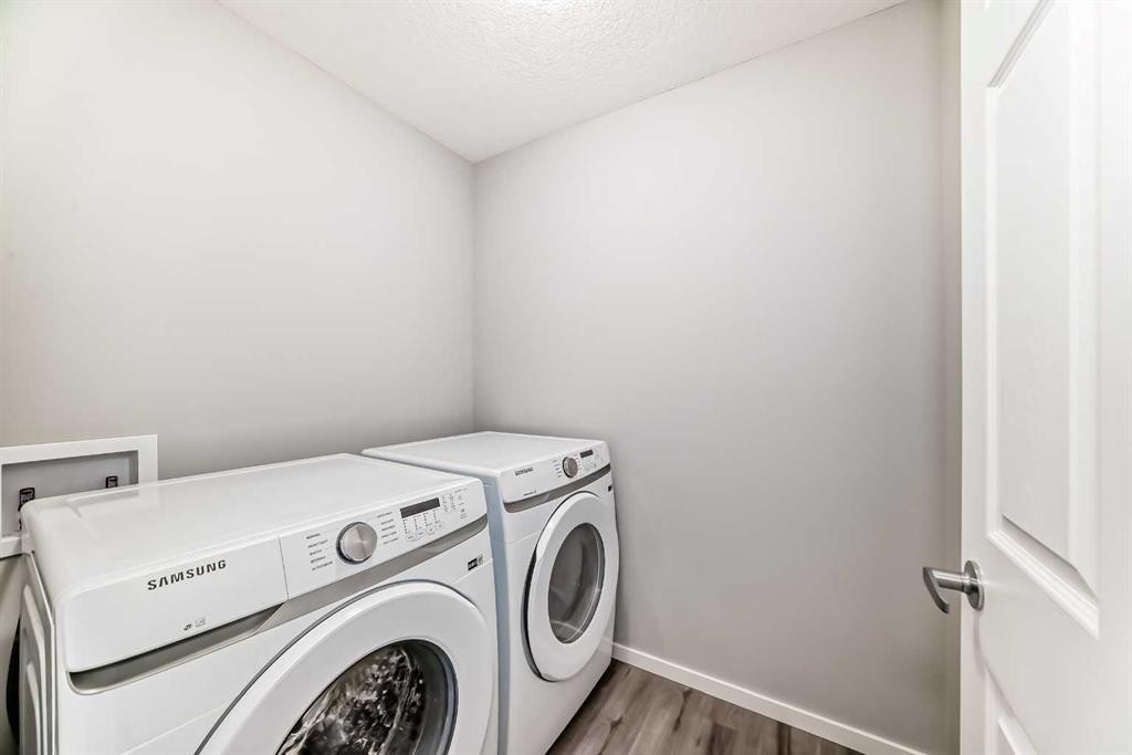 224 Carringham Way Nw, Calgary, AB - Indoor Photo Showing Laundry Room