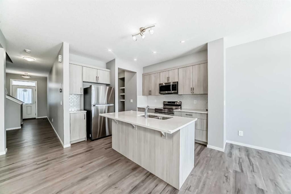 224 Carringham Way Nw, Calgary, AB - Indoor Photo Showing Kitchen With Stainless Steel Kitchen With Double Sink With Upgraded Kitchen