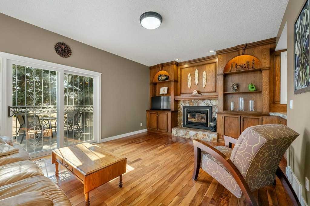44 Deerbrook Crescent Se, Calgary, AB - Indoor Photo Showing Living Room With Fireplace