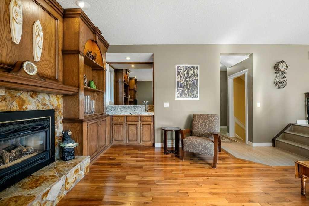 44 Deerbrook Crescent Se, Calgary, AB - Indoor Photo Showing Living Room With Fireplace
