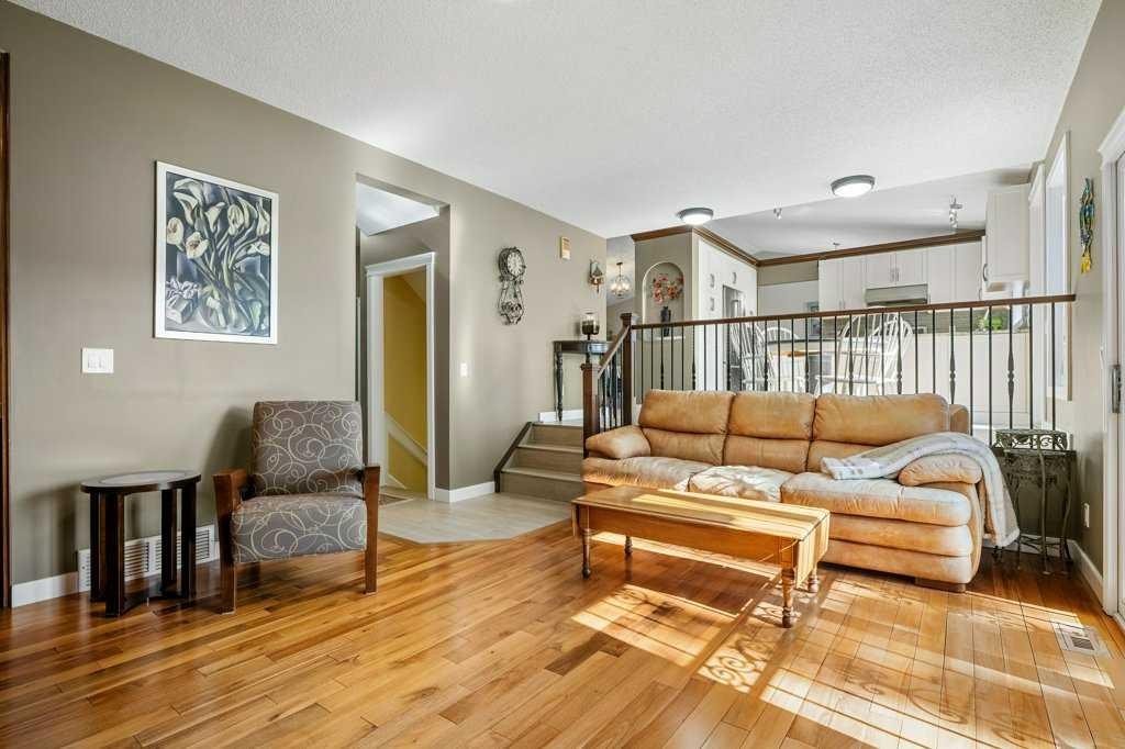 44 Deerbrook Crescent Se, Calgary, AB - Indoor Photo Showing Living Room