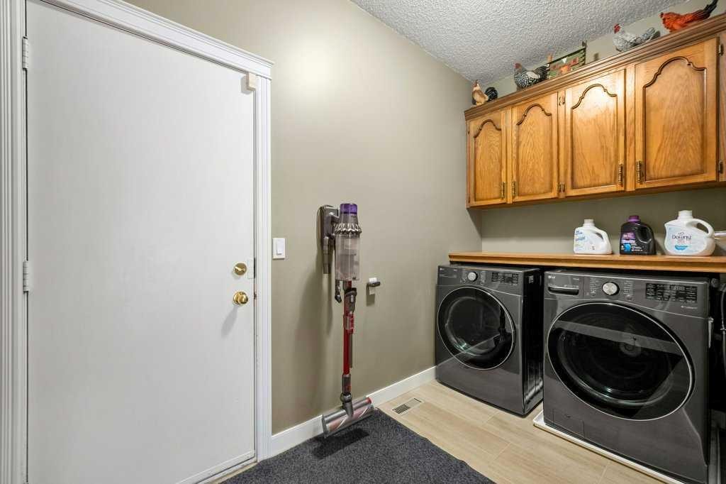 44 Deerbrook Crescent Se, Calgary, AB - Indoor Photo Showing Laundry Room
