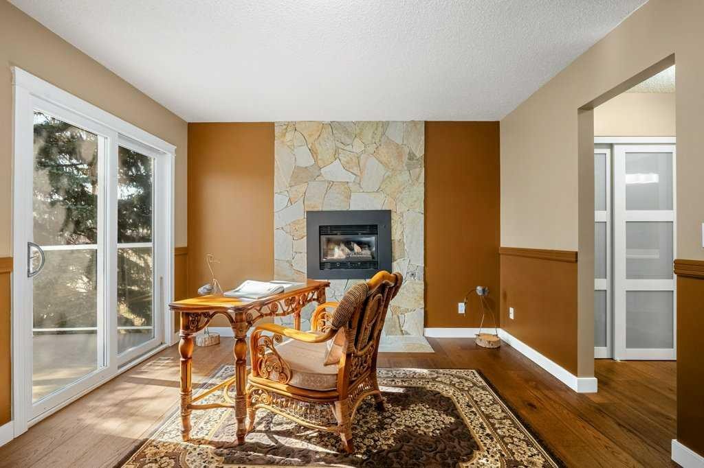 44 Deerbrook Crescent Se, Calgary, AB - Indoor With Fireplace