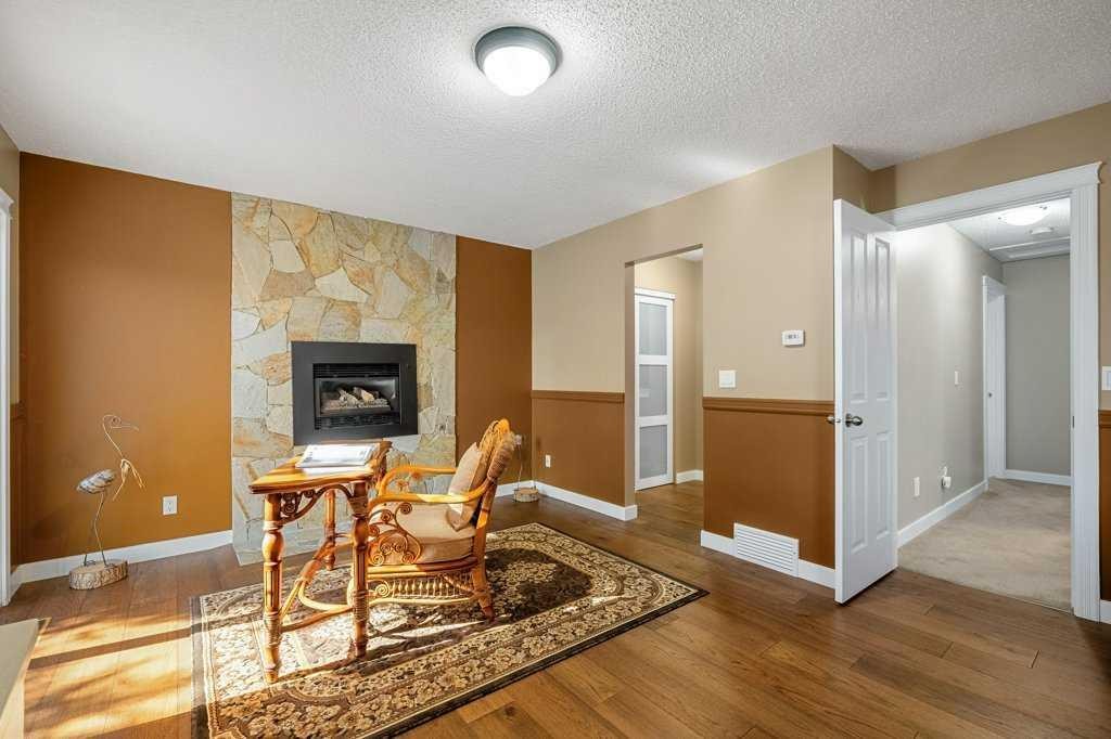 44 Deerbrook Crescent Se, Calgary, AB - Indoor With Fireplace