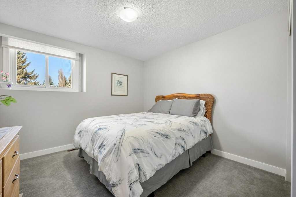 44 Deerbrook Crescent Se, Calgary, AB - Indoor Photo Showing Bedroom
