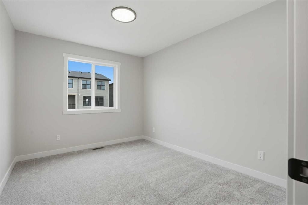 68 Buffaloberry Manor Se, Calgary, AB - Indoor Photo Showing Other Room