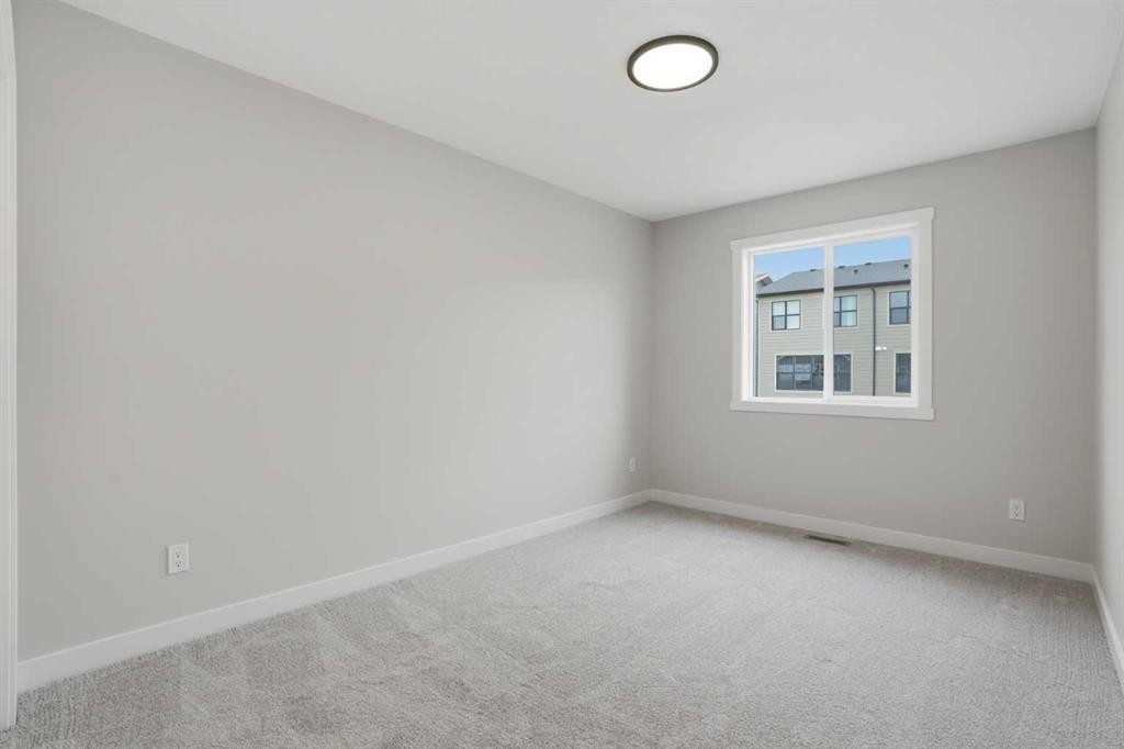 68 Buffaloberry Manor Se, Calgary, AB - Indoor Photo Showing Other Room