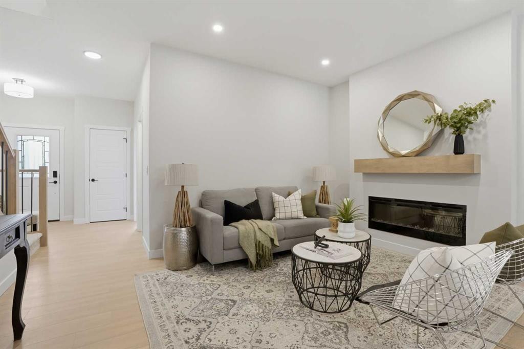 68 Buffaloberry Manor Se, Calgary, AB - Indoor Photo Showing Living Room With Fireplace