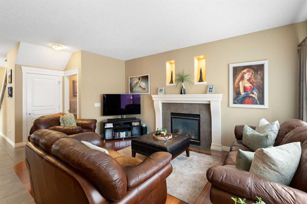 40 Bridleridge Lane Sw, Calgary, AB - Indoor Photo Showing Living Room With Fireplace