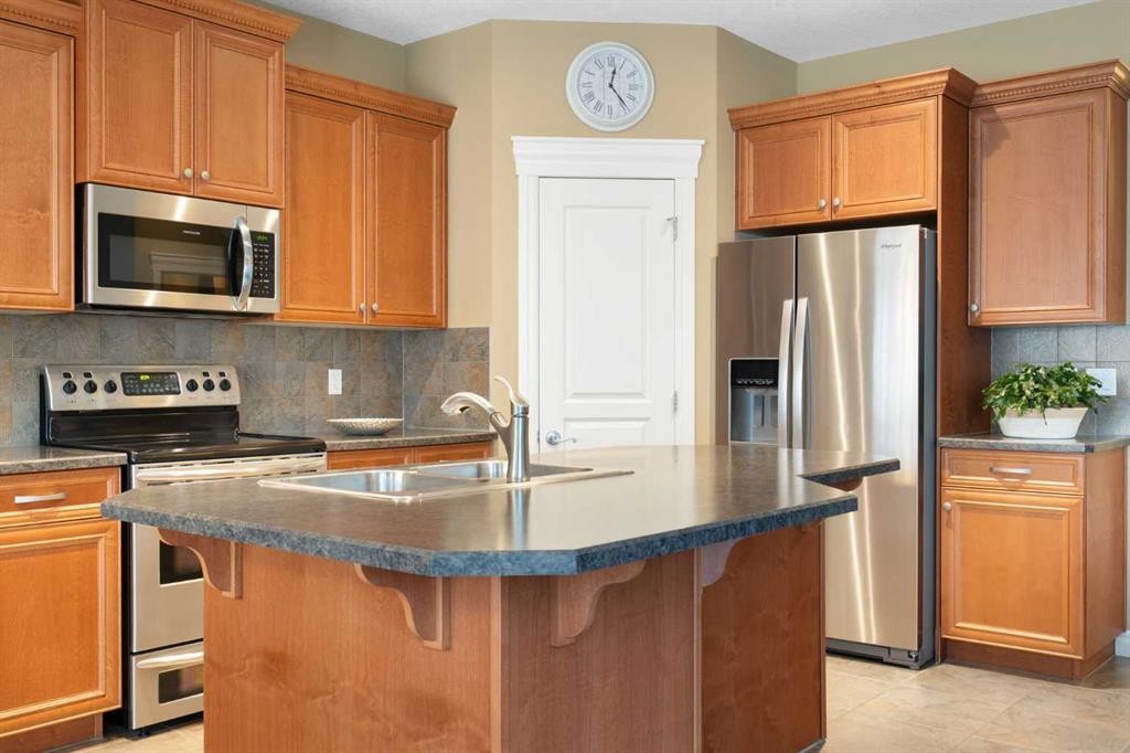 40 Bridleridge Lane Sw, Calgary, AB - Indoor Photo Showing Kitchen With Stainless Steel Kitchen With Double Sink
