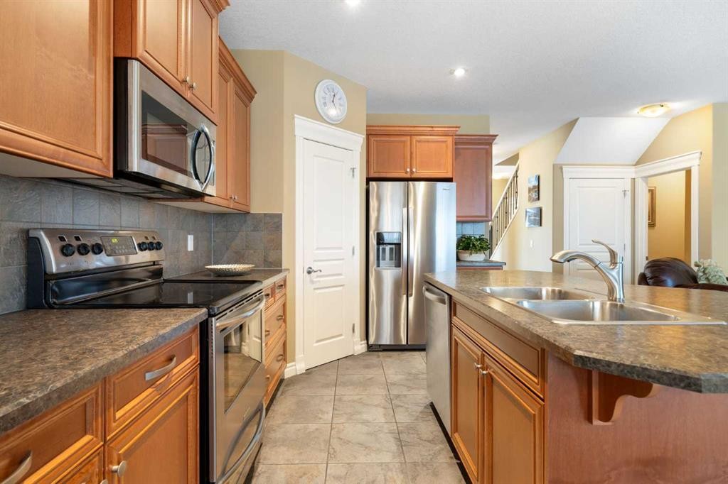 40 Bridleridge Lane Sw, Calgary, AB - Indoor Photo Showing Kitchen With Stainless Steel Kitchen With Double Sink