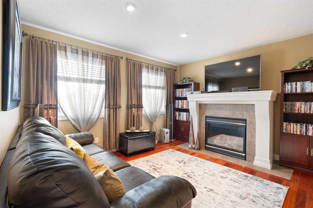 40 Bridleridge Lane Sw, Calgary, AB - Indoor Photo Showing Living Room With Fireplace