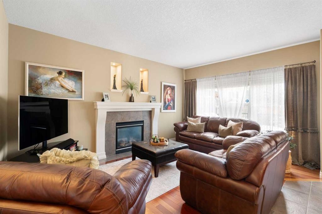 40 Bridleridge Lane Sw, Calgary, AB - Indoor Photo Showing Living Room With Fireplace