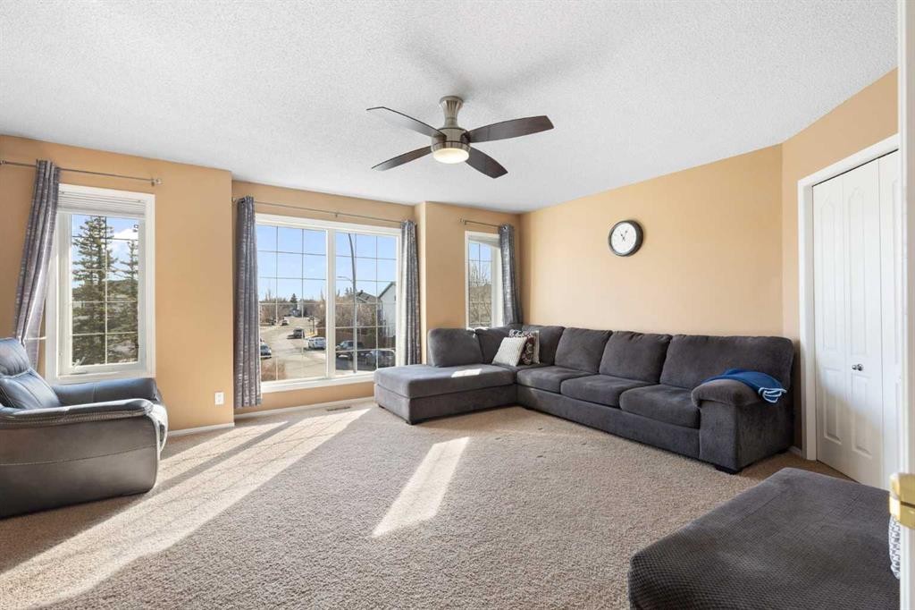 227 Bridlewood Circle Sw, Calgary, AB - Indoor Photo Showing Living Room