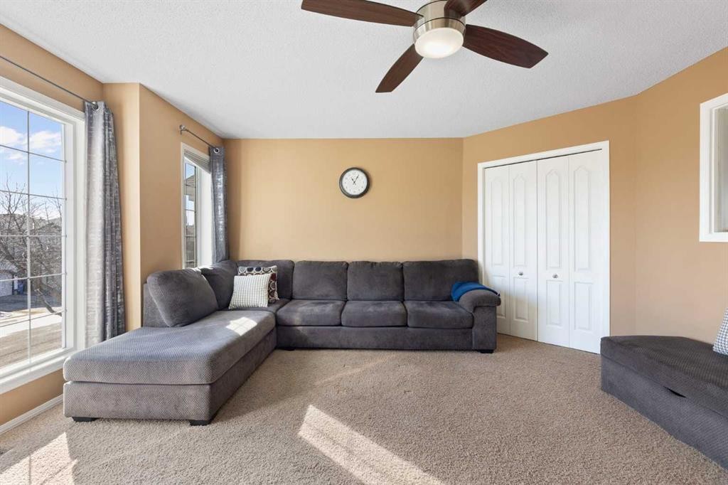 227 Bridlewood Circle Sw, Calgary, AB - Indoor Photo Showing Living Room