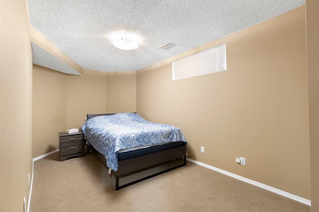 227 Bridlewood Circle Sw, Calgary, AB - Indoor Photo Showing Bedroom