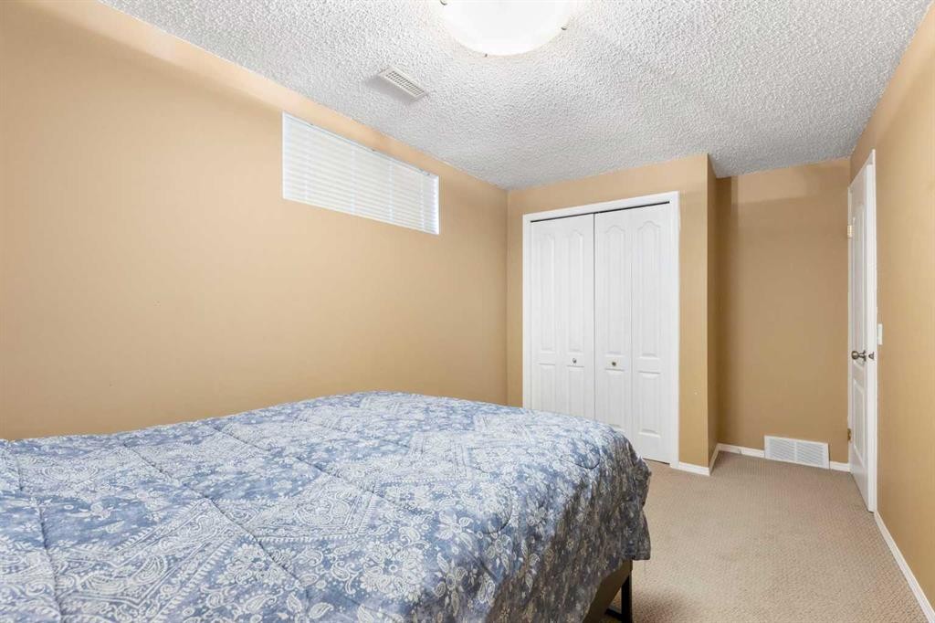 227 Bridlewood Circle Sw, Calgary, AB - Indoor Photo Showing Bedroom