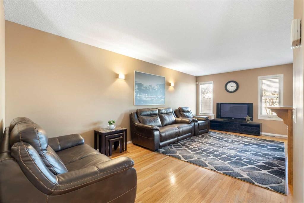 227 Bridlewood Circle Sw, Calgary, AB - Indoor Photo Showing Living Room