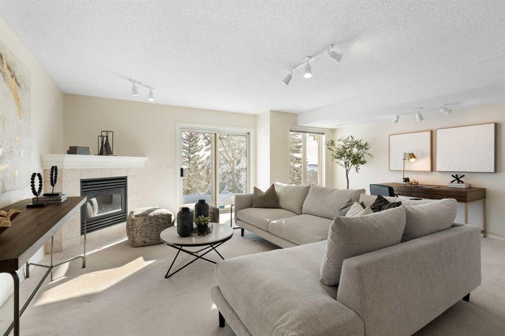 100 Hamptons Link Nw, Calgary, AB - Indoor Photo Showing Living Room With Fireplace