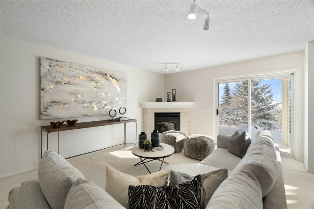 100 Hamptons Link Nw, Calgary, AB - Indoor Photo Showing Living Room With Fireplace