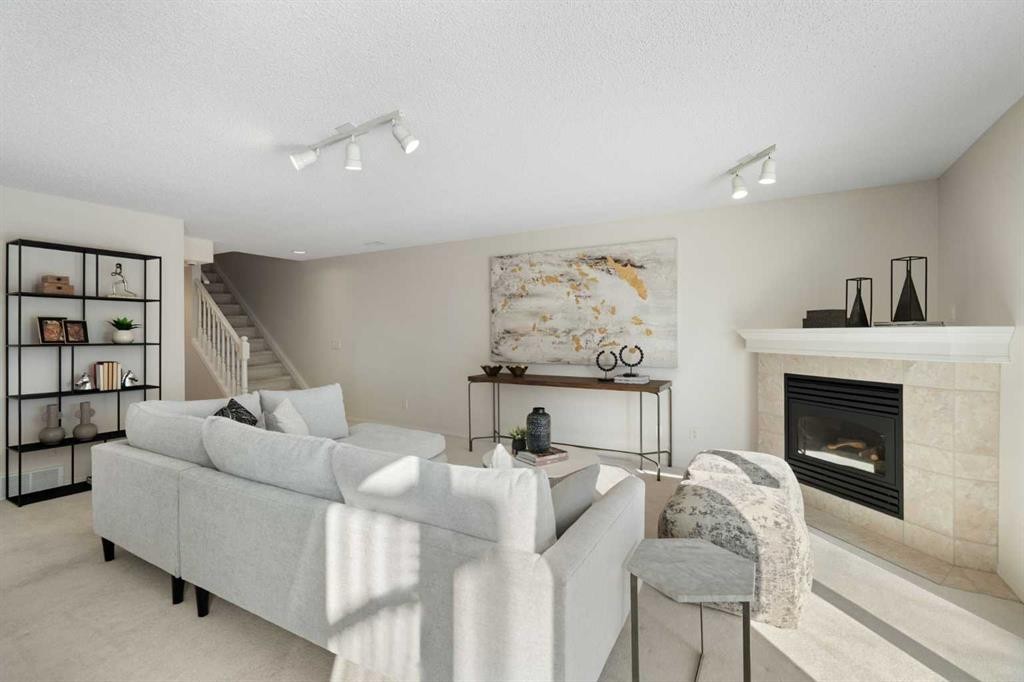100 Hamptons Link Nw, Calgary, AB - Indoor Photo Showing Living Room With Fireplace