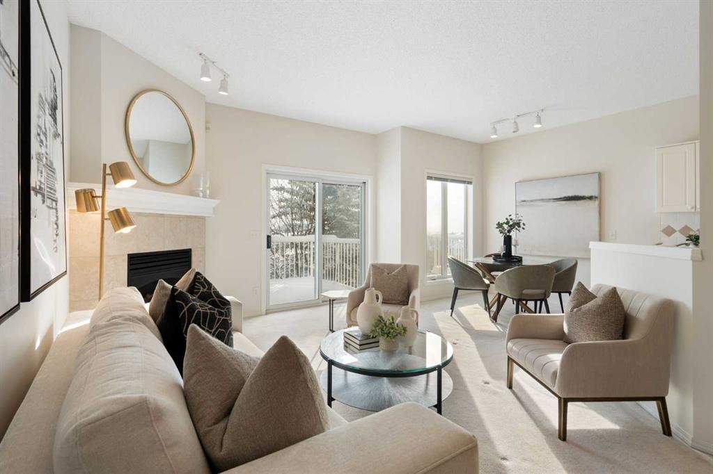 100 Hamptons Link Nw, Calgary, AB - Indoor Photo Showing Living Room With Fireplace