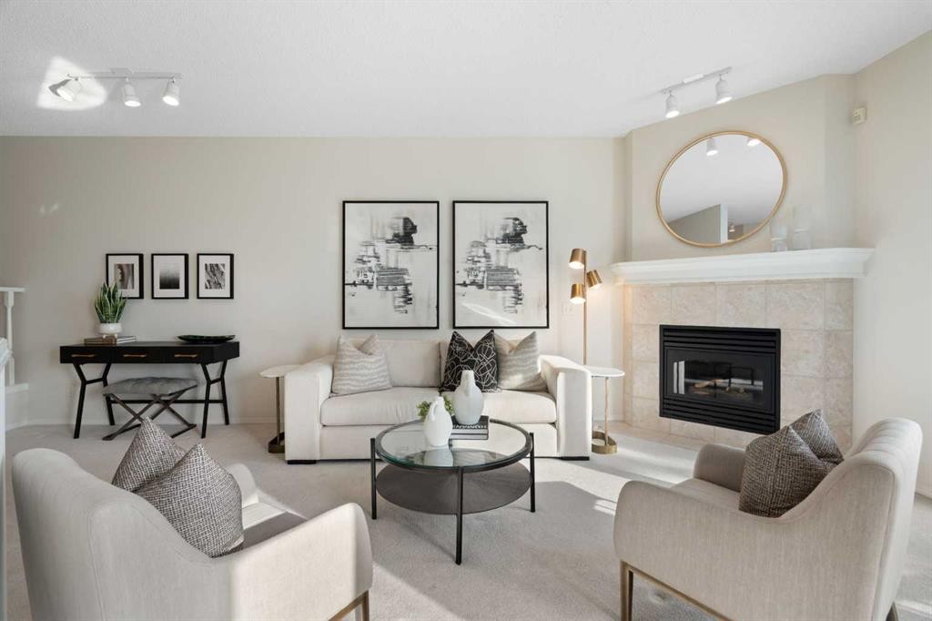 100 Hamptons Link Nw, Calgary, AB - Indoor Photo Showing Living Room With Fireplace