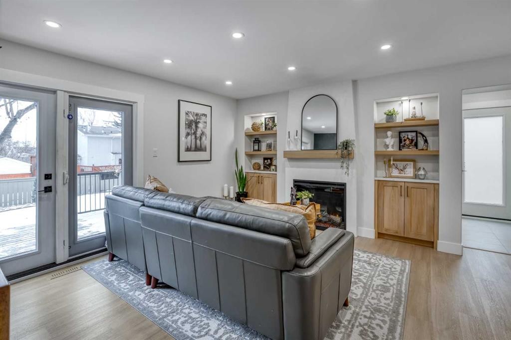 168 Oakside Circle, Calgary, AB - Indoor Photo Showing Living Room With Fireplace