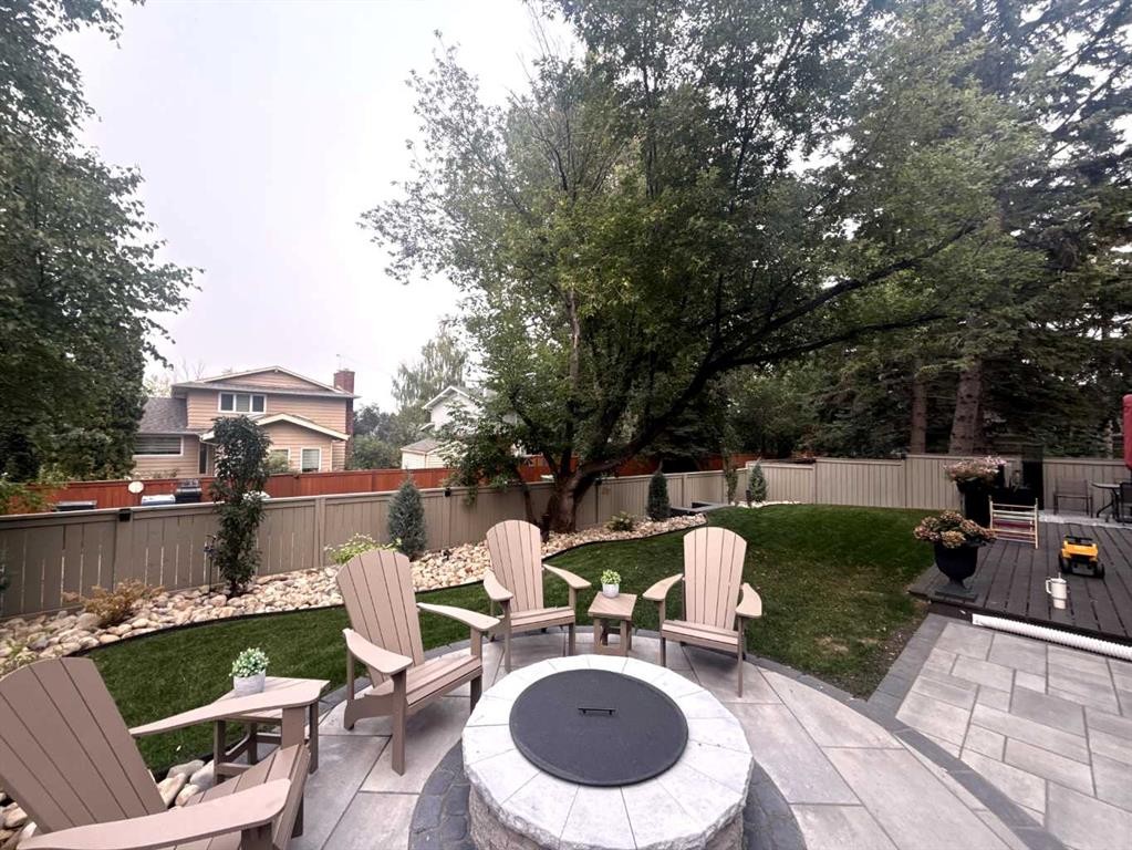 168 Oakside Circle, Calgary, AB - Outdoor With Deck Patio Veranda With Backyard