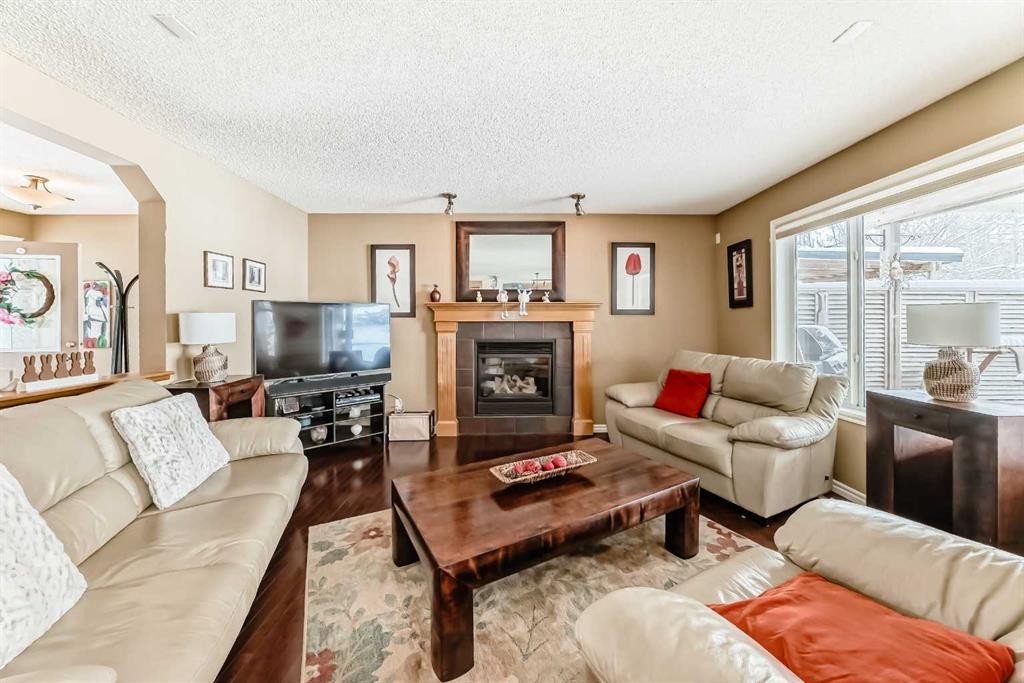 41 Kincora Drive Nw, Calgary, AB - Indoor Photo Showing Living Room With Fireplace