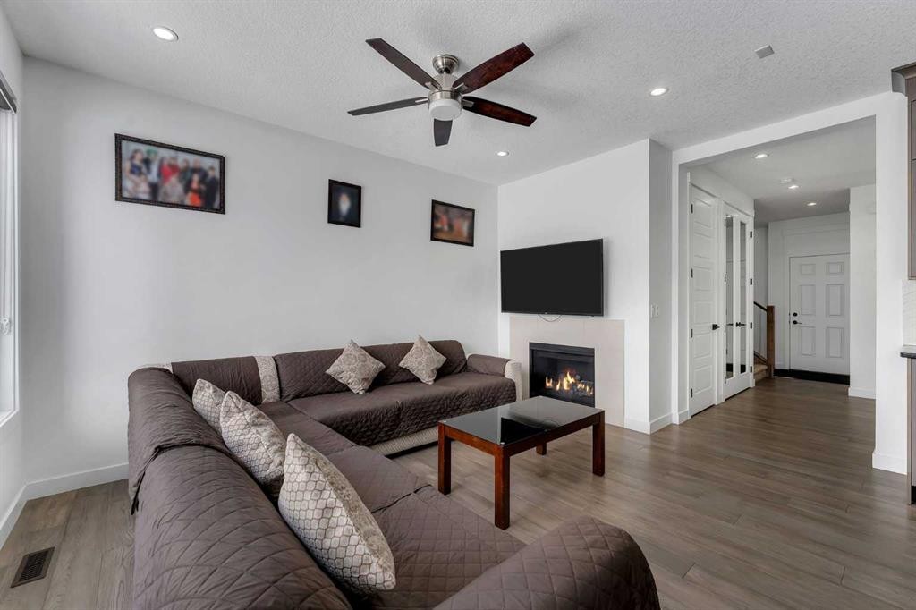 43 Saddlelake Manor Ne, Calgary, AB - Indoor Photo Showing Living Room With Fireplace