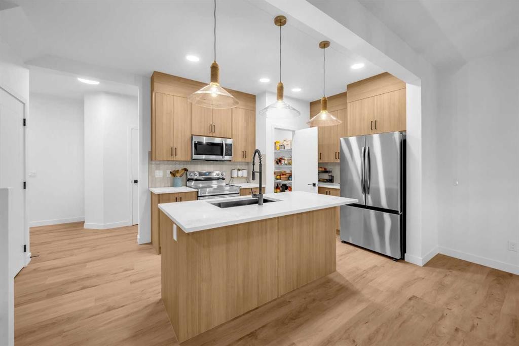 288 Sora Terrace Se, Calgary, AB - Indoor Photo Showing Kitchen With Stainless Steel Kitchen With Double Sink With Upgraded Kitchen